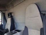 two seats in the back of a van with a cup holder
