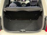 two seats in the back of a car with the trunk open