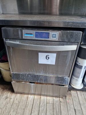 a silver dishwasher with a number 6 on it