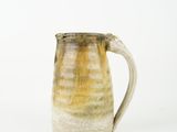 a close up of a coffee mug on a white surface