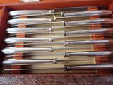 a lot of knives in a box on a table