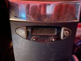 a close up of a machine with a clock on it ' s side