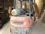an image of a forklift in a garage