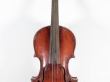 an old violin sitting on a white surface with a white background