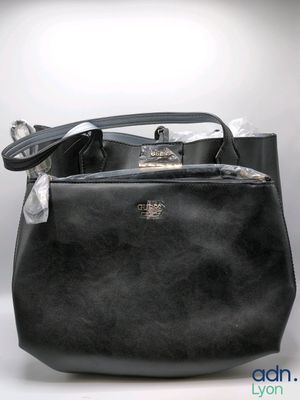 black leather handbag with a silver handle on a white background