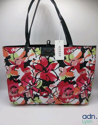 a floral bag with a price tag on it