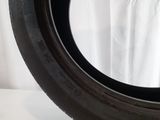 a close up of a tire tire on a white surface