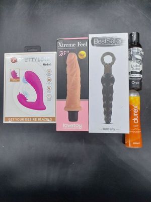 a box of sex products and a bottle of sex products on a table