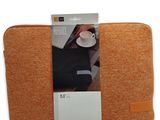 an image of a laptop sleeve with a coffee cup in it