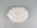 a white plate with writing on it sitting on a table