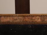 a picture of a mirror with a wooden frame on it