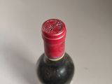 a bottle of wine that is sitting on a table