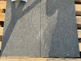 a pile of gray granite on a pallet