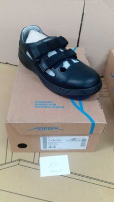 a pair of shoes that are on top of a box