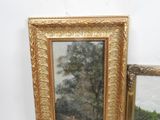 a picture of a painting on the wall next to a mirror