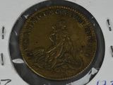 a gold coin with a picture of a woman on it