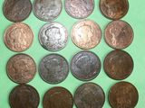 a lot of coins that are on a green surface