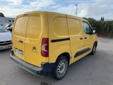 yellow citrole van parked in a parking lot next to other cars