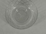 a glass bowl that is sitting on a table
