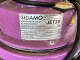 a close up of a purple jet that is sitting on a table
