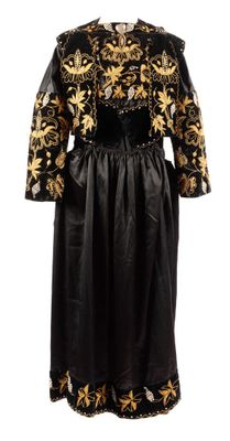 a black and gold dress with gold flowers on it