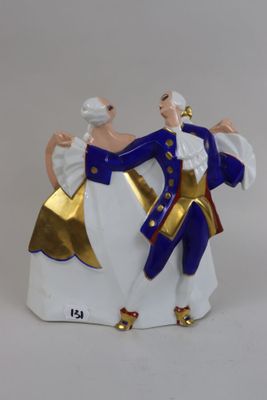 a figurine of a man and a woman dancing
