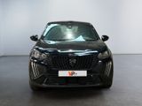 the front view of a black car in a white room
