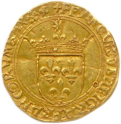 a close up of a gold coin with a crown on it