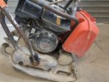 a small engine sitting on top of a concrete block