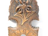 an image of a metal object with a flower on it