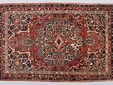 an antique persian rug with a floral design on a white background