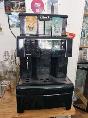 a coffee machine that is sitting on a wooden table