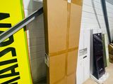a large cardboard box sitting in front of a wall
