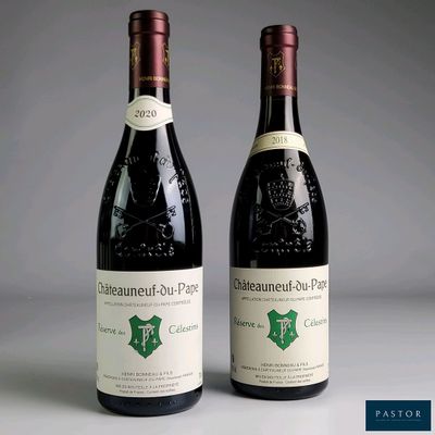 two bottles of wine sitting next to each other on top of a table
