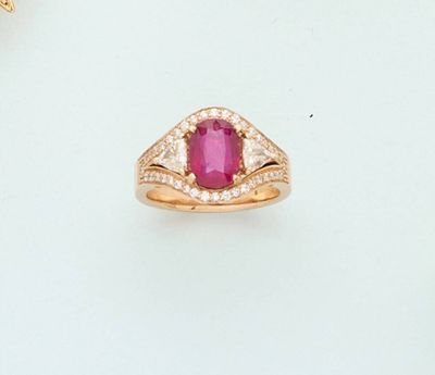 an image of a ring with a ruby stone and diamond accents