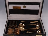 a black case with silverware in it on a table