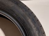 a close up of a tire on a white surface