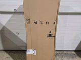 a cardboard box sitting on the floor in front of a garage door
