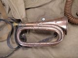 a brass trumpet with a gas mask attached to it