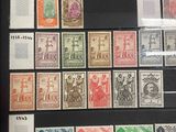 a group of stamps on display in a glass case
