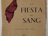 un vieux livre sur lequel figure l'image d'un parapluie rouge