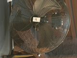 a fan that is attached to the side of a building
