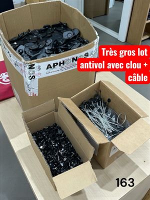 two boxes of screws and a box of wires on a table