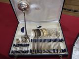 a case with silverware in it on a red table