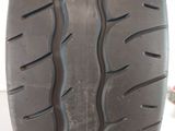 a close up of a tire on a white surface with a white background