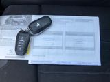 a car key sitting on top of a piece of paper in the back seat of a car