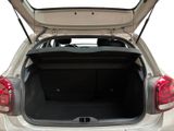 the back of a silver car with its trunk open on a white background