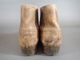 a close up of a pair of old shoes on a table