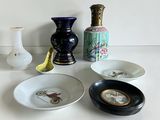 many different types of vases and bowls on the table