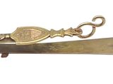 a small gold pocket knife with a keychain attached to it